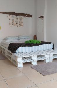 Ένα ή περισσότερα κρεβάτια σε δωμάτιο στο Green House