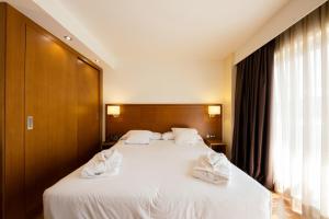 Postel nebo postele na pokoji v ubytování Hotel Thalasso Cantabrico Las Sirenas 4 Superior