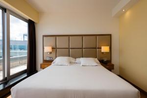Postel nebo postele na pokoji v ubytování Hotel Thalasso Cantabrico Las Sirenas 4 Superior