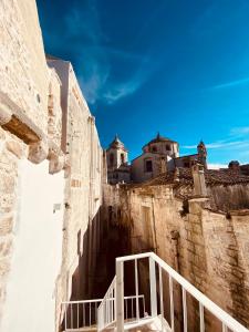a view from the side of a building with a stairway at La Finestra Dimora Charme in Ceglie Messapica