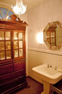 a bathroom with a sink and a mirror at Studio Rempart in Brussels