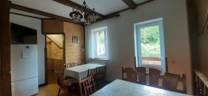 a kitchen and dining room with a table and chairs at Соломія in Slavske
