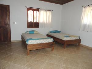 מיטה או מיטות בחדר ב-Cabañitas del Mar by Rotamundos