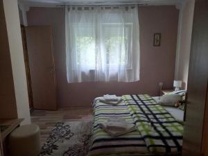 Postel nebo postele na pokoji v ubytování Rooms Luka
