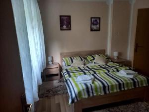 Postel nebo postele na pokoji v ubytování Rooms Luka