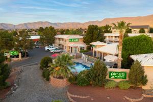 an aerial view of a resort with a parking lot at Pines Inn & Suites in Cottonwood