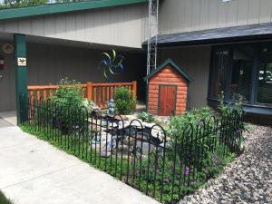 a black fence in front of a house at Rustic Manor in Saint Germain