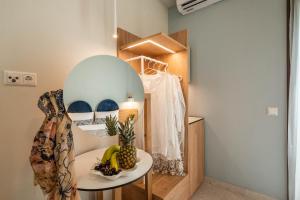 a room with a table with bananas and a mirror at Syvota Gardens in Syvota