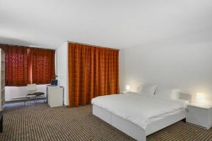 Neuchâtel City Hôtel 객실 침대