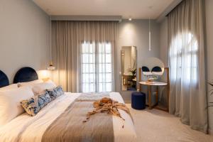 a bedroom with a large bed with a decoration on it at Syvota Gardens in Syvota