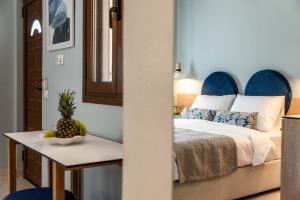 a bedroom with a bed and a table with a pineapple on it at Syvota Gardens in Syvota