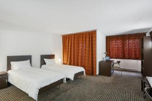 Neuchâtel City Hôtel 객실 침대