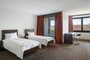 Neuchâtel City Hôtel 객실 침대