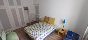 Un pat sau paturi într-o cameră la Appartement Jean Jaurès refait à neuf