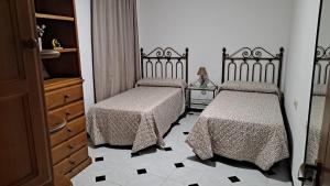 Łóżko lub łóżka w pokoju w obiekcie Casa El Villa