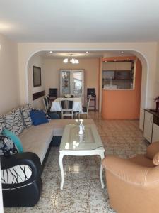 a living room with a couch and a table at Dona Apartments in Ohrid