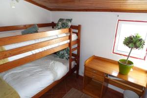 Łóżko lub łóżka piętrowe w pokoju w obiekcie Catus Homie