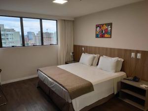 Hotel 7 Itajaí房間的床