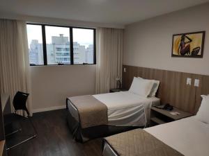 Hotel 7 Itajaí房間的床