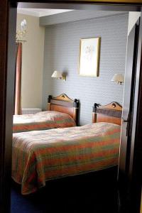 
Łóżko lub łóżka w pokoju w obiekcie Arkadia Gościniec
