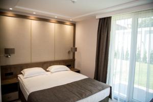 Postel nebo postele na pokoji v ubytování Arletti Hotel