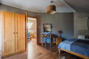 Postel nebo postele na pokoji v ubytování Dom gościnny Szulcówka