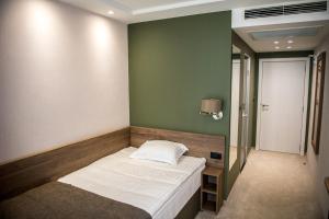 Postel nebo postele na pokoji v ubytování Arletti Hotel