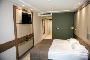 Postel nebo postele na pokoji v ubytování Arletti Hotel