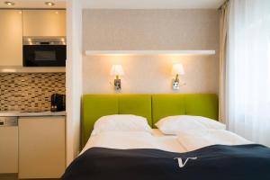 Postel nebo postele na pokoji v ubytování Vienna Residence, Rochusmarkt - Wien Mitte