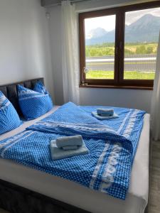 Posteľ alebo postele v izbe v ubytovaní u Boženky