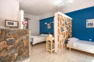 A bed or beds in a room at Stavros Villas&Apartments