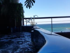 a bath tub with a view of the ocean at PARADISE SUITES Buenavista Beach in Fuengirola