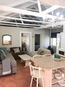 a living room with a couch and a table at Boskloof Swemgat in Clanwilliam