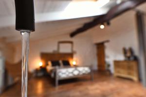 a stream of water pouring into a living room at Le Bruit de l'Eau (Chambre Loft) in Labeaume