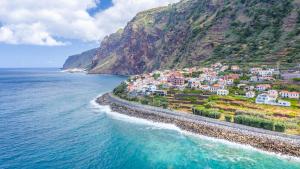an aerial view of a village on the side of a mountain at Casa do Calhau in Jardim do Mar