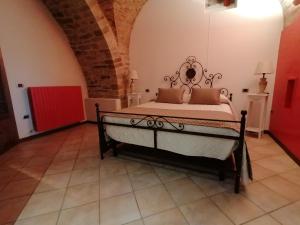 Postel nebo postele na pokoji v ubytování Assisi Garden Suite