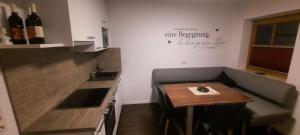 a small kitchen with a small table and a counter at Appartement Thunhart Wilfried&Elisabeth in Altenmarkt im Pongau