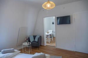 TV a/nebo společenská místnost v ubytování Suite Cuveé Zell