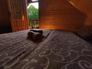 Ένα ή περισσότερα κρεβάτια σε δωμάτιο στο Secret Garden Kolašin