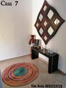 a room with a table and a rug on the floor at Casa 7 in Mazatlán