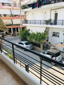 a view of a street from a balcony of a building at Cozy Apartment Near City Center in Preveza