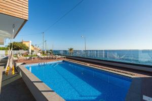 a swimming pool on the roof of a building at Villa Sea - Rural Holiday Experience by SeaPearl in Paul do Mar