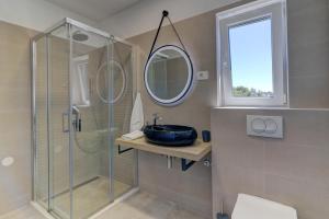 Kúpeľňa v ubytovaní APARTMANI OLIMP1