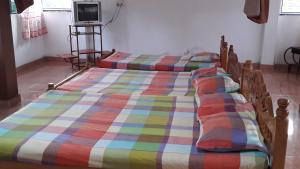 Ένα ή περισσότερα κρεβάτια σε δωμάτιο στο Kunam Beach Rest Inn