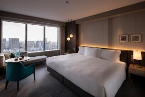 מיטה או מיטות בחדר ב-The Strings by InterContinental, Tokyo by IHG