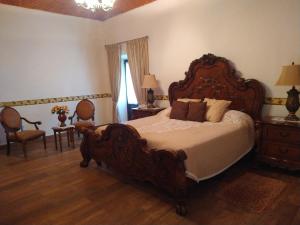 Postel nebo postele na pokoji v ubytování Hotel Spa Hacienda Real la Nogalera