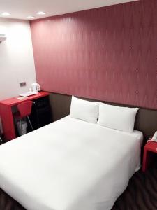 Voodi või voodid majutusasutuse Hotel 6 - ZhongHua toas