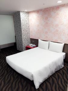 Voodi või voodid majutusasutuse Hotel 6 - ZhongHua toas
