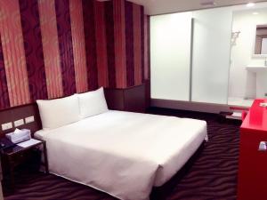 Voodi või voodid majutusasutuse Hotel 6 - ZhongHua toas