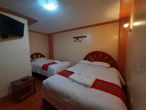 Cama ou camas em um quarto em Machupicchu Lodging